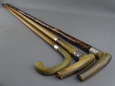 THREE HORN HANDLED WALKING STICKS with hallmarked silver collars, 92.5 cms the longest