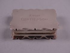 AN OBLONG PLAIN SILVER SNUFF BOX with shaped rim, Birmingham 1928 by Deakin & Francis