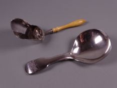 A FIDDLE PATTERNED WILLIAM IV SILVER CADDY SPOON, London 1849 and a Georgian silver 'shovel' caddy