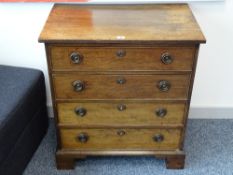 A NEAT MAHOGANY CHEST OF FOUR DRAWERS, oak lined with circular brass backplates and ring pull