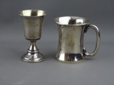 A WAISTED FORM SILVER CHRISTENING MUG and a small silver pedestal goblet, Birmingham 1915 and 1977