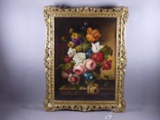 L SEAGER oil on canvas - still life flowers in a vase on a table, signed, 39 x 29 cms