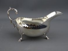 AN IRISH CLASSICAL DESIGN SILVER GRAVY BOAT, Dublin 1968, 6.3 troy ozs, classical 'C' shaped