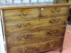 AN EARLY 19th CENTURY MAHOGANY CHEST of two short over three long oak lined drawers, having swan