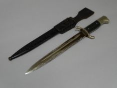 A GERMAN WORLD WAR II FIREMAN'S SAWBACK LONG MODEL DRESS BAYONET, stamped 'W K C' to the blade, in