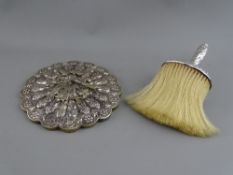 A VICTORIAN SILVER BONNET BRUSH and an Eastern white metal circular hand mirror with Hoho bird