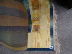 Modern amber and green tassel ended rug