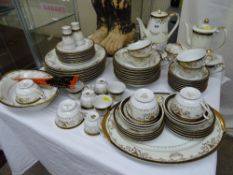 Good quantity of black and gilt decorated tea, coffee and tableware, marked 'Handpainted First China