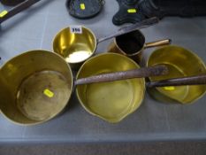 Group of vintage brass and iron handled cooking pans