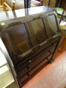 Dark wood Priory style three drawer writing bureau