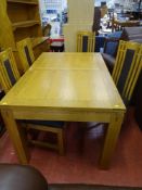 Excellent modern oak extending dining table and four chairs