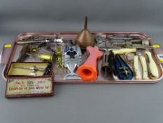 Collection of vintage and antique corkscrews, wine taps, copper funnel etc, some named