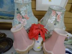 Two pairs of decorative table lamps and a pottery vase
