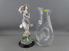 Stylish glass jug and a composite figurine of a pixie from the Leonardo Collection