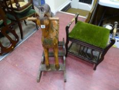 Vintage carved wood rocking horse and a green upholstered lyre style piano stool