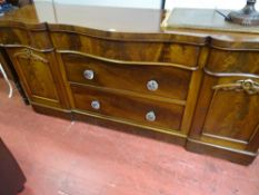 Victorian mahogany sideboard with serpentine front having two base drawers with glass knobs and