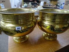 Pair of brass planters with goat mask handles