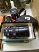 Vintage SLR camera, boxed Pentacon lens and a Nikon digital camera