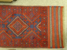 Meshwani carpet runner, red ground single bordered with repeating central diamond pattern, 245 x