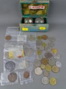 Collection of vintage, mainly foreign coinage and a pair of cased Chinese iron ball bells with