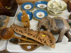 Carved treen to include an African elephant, a group of rhinos, two vintage ladles etc
