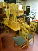 Modern pine dining table and eight modern light oak highback dining chairs