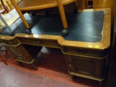 French Renaissance style inverted breakfront twin pedestal desk on reeded supports with brass