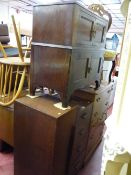 Compact oak tallboy and a two over two door mahogany side cabinet