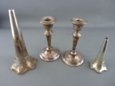 Pair of loaded base candlesticks and two epergne flutes, all hallmarked silver