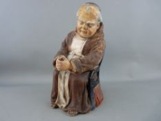 Continental terracotta tobacco jar in the form of a seated monk