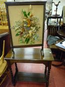 Oak barley twist two tier side table and a floral decorated firescreen