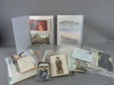 Collection of vintage postcards and ephemera including street scenes with motor vehicles and trams