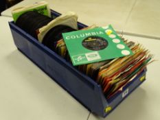 Plastic crates containing an assortment of 45rpm records including Elvis Presley, The Beatles, Tom