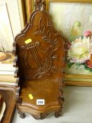 French carved walnut display stand in the form of a throne