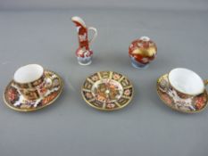 Royal Crown Derby miniatures including a GR 1911 commemorative trio and a coffee can and saucer in