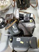 Collection of vintage cameras and associated equipment
