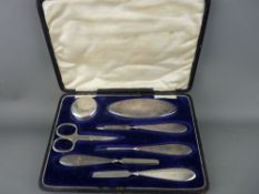 Cased hallmarked silver manicure set inscribed 'Mona' (scissors not original)