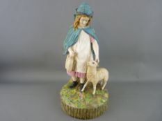 Victorian pottery figurine depicting a young girl in blue hooded cloak with a sheep at her feet,