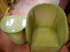 Lloyd loom style armchair and a similar glass topped linen basket