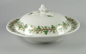 A SWANSEA PORCELAIN MUFFIN DISH & COVER of circular form with acorn finial emerging from six leaves,