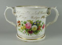 A STAFFORDSHIRE PORCELAIN (POSSIBLY COALPORT) LOVING CUP TO COMMEMORATE REV. HUGH PUGH OF MOSTYN (