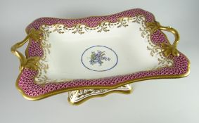 A SWANSEA PORCELAIN TWIG-HANDLED CENTRE DISH the borders with scale decoration in purple, the centre