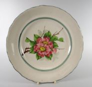 A LLANELLY POTTERY PLATE DECORATED WITH WILD-ROSES with slightly wavy rim, no base marks, old