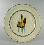 A LLANELLY PLATE DECORATED WITH SAIL BOATS with slight wavy border, 22cms diam Condition Report: