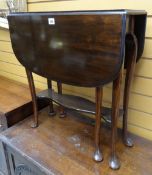 A vintage mahogany two-tier Sutherland tea table