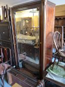A Continental mahogany & brass inlaid mirrored armoire