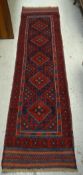 A 100% hand knotted woollen Meshwani runner, 248 x 65cms