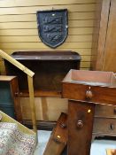 An open bookcase, five mahogany drawers from a Victorian chest & a heraldic plaque