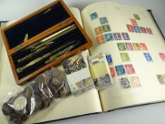 A vintage blue stamp album & approximately 20% completion, parcel of loose coinage, collector's