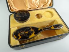 A fitted case for a dressing-table set with part complete original contents of silver &